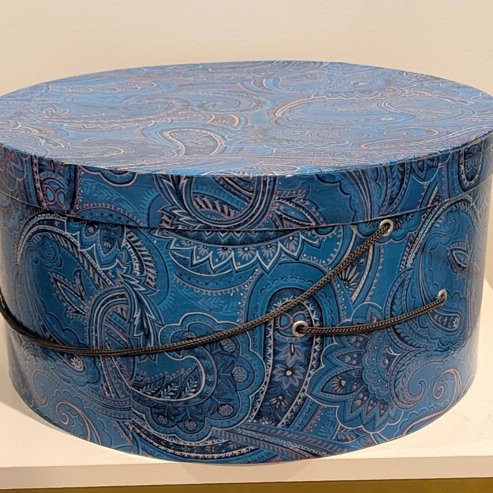 Decorative box for hat, storage or gift. Kinda weird color.